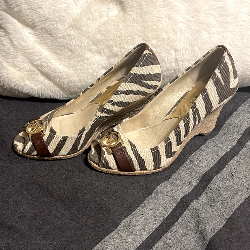 MICHAEL Michael Kors Zebra Print Wedge Pumps with Brown Trim and Gold Logo
